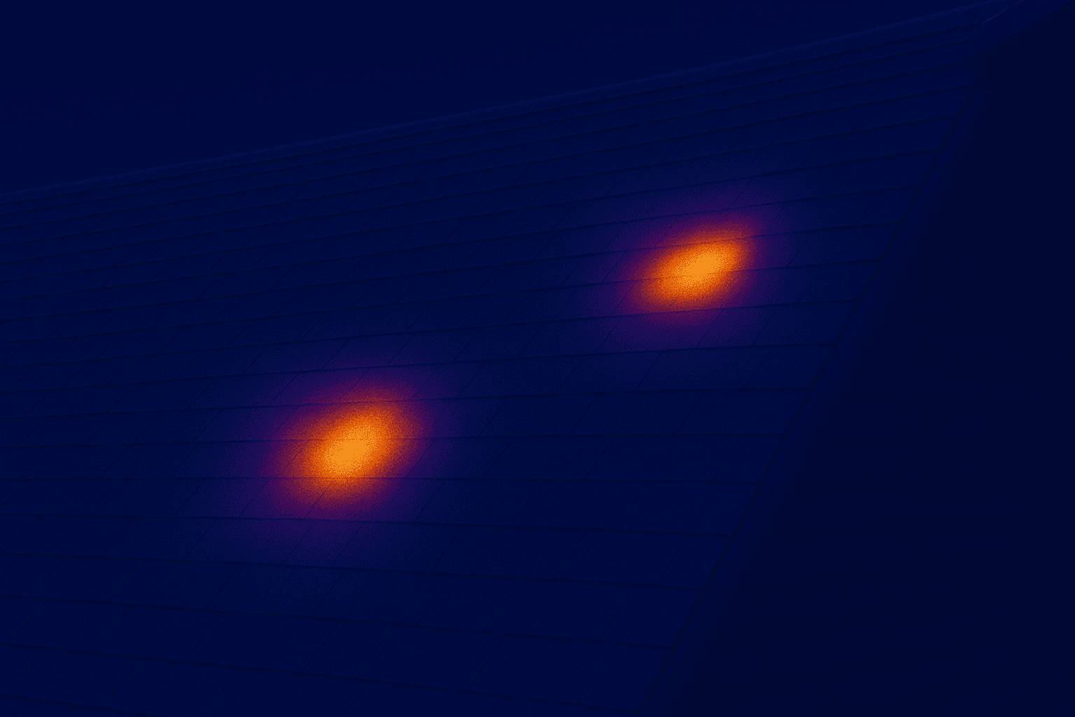Thermal image of a residential roof showing multiple hot spots that indicate possible storm-related moisture damage.